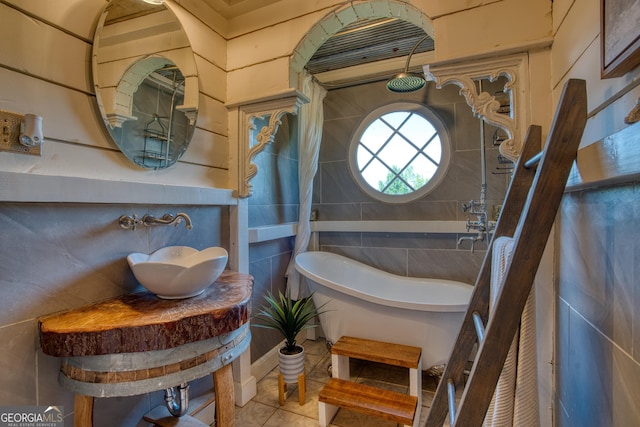 407 E 3rd St, Rome, GA 30161 - full bathroom with a freestanding bath, tile patterned floors, tile walls, and a sink