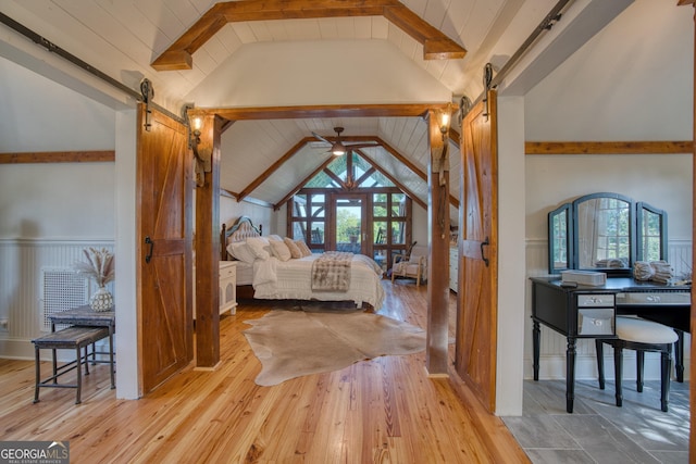 bedroom featuring a barn door, wood-type flooring, and wood ceiling
