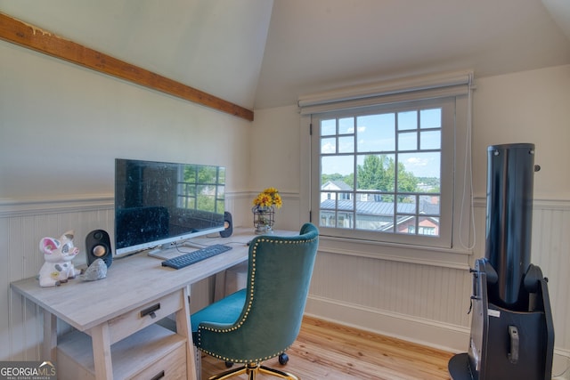 office space featuring a wainscoted wall, wood finished floors, and vaulted ceiling