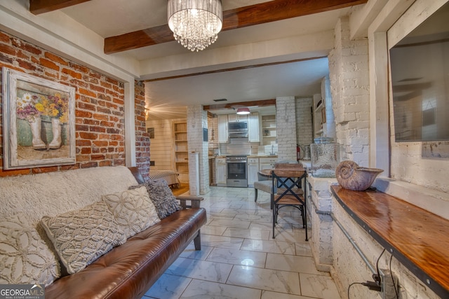 407 E 3rd St, Rome, GA 30161 - living room featuring a chandelier, a wood stove, light marble finish floors, beam ceiling, and brick wall
