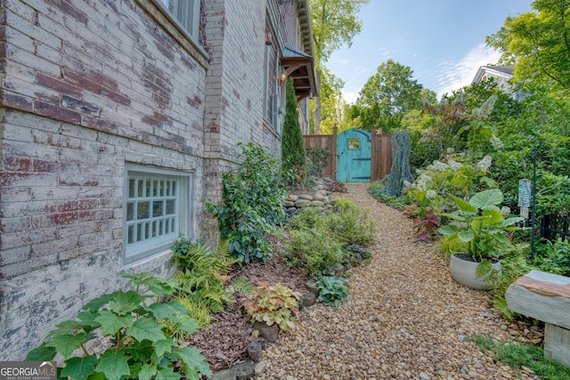 view of yard with a gate and fence