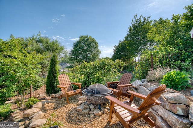 view of yard with an outdoor fire pit