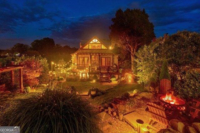 407 E 3rd St, Rome, GA 30161 - back of house at night featuring a fire pit and stairway