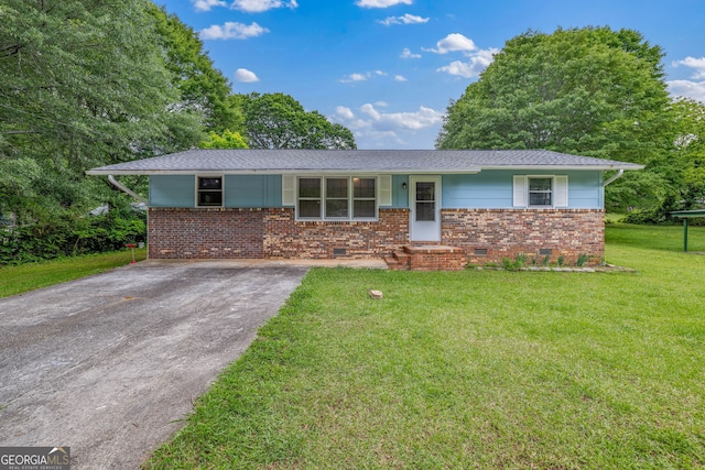 single story home with crawl space, a front yard, brick siding, driveway, and a shingled roof