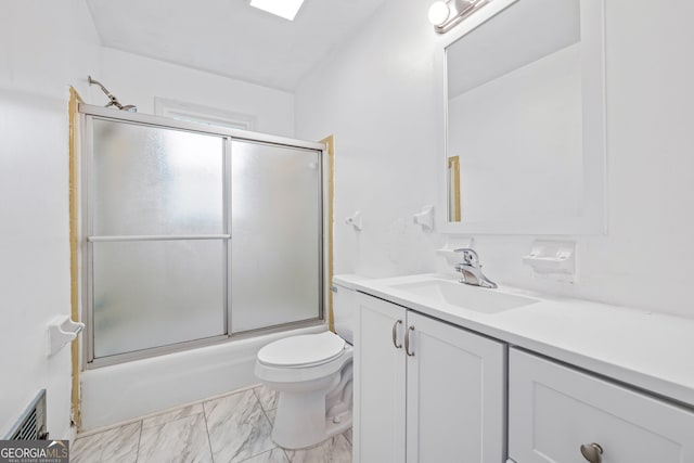 bathroom featuring vanity, toilet, enclosed tub / shower combo, and marble look tile flooring