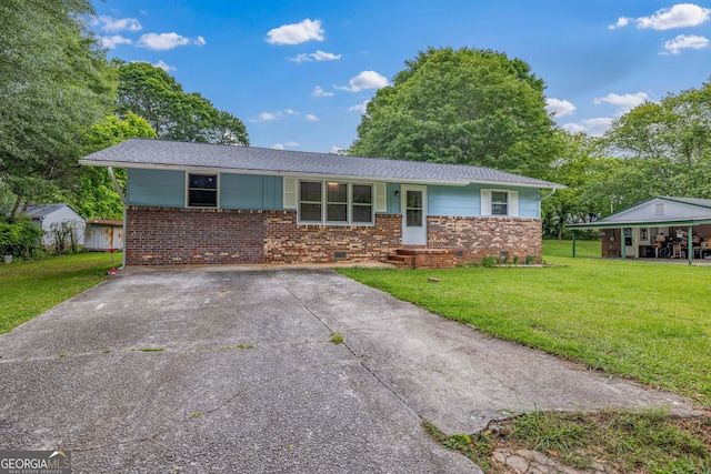ranch-style home with brick siding, a front yard, crawl space, and concrete driveway