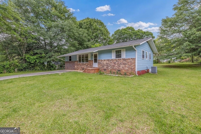 ranch-style home featuring crawl space, central AC unit, a front lawn, and brick siding