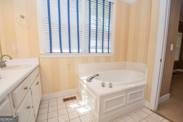 24 Overbrook Ct, Newnan, GA 30263 - bathroom with baseboards, wallpapered walls, tile patterned floors, a garden tub, and vanity