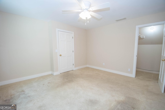 24 Overbrook Ct, Newnan, GA 30263 - unfurnished bedroom with carpet floors, baseboards, a spacious closet, a ceiling fan, and a closet