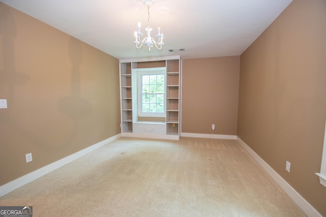 24 Overbrook Ct, Newnan, GA 30263 - empty room featuring a chandelier, light carpet, and baseboards