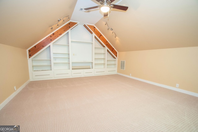 24 Overbrook Ct, Newnan, GA 30263 - bonus room with baseboards, lofted ceiling, a ceiling fan, light colored carpet, and built in shelves