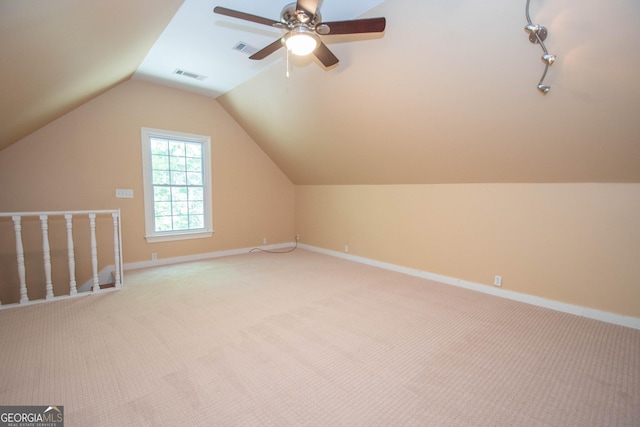 24 Overbrook Ct, Newnan, GA 30263 - additional living space featuring light colored carpet, vaulted ceiling, baseboards, and a ceiling fan