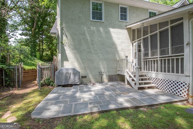 24 Overbrook Ct, Newnan, GA 30263 - rear view of house featuring stucco siding, a sunroom, fence, and a patio area