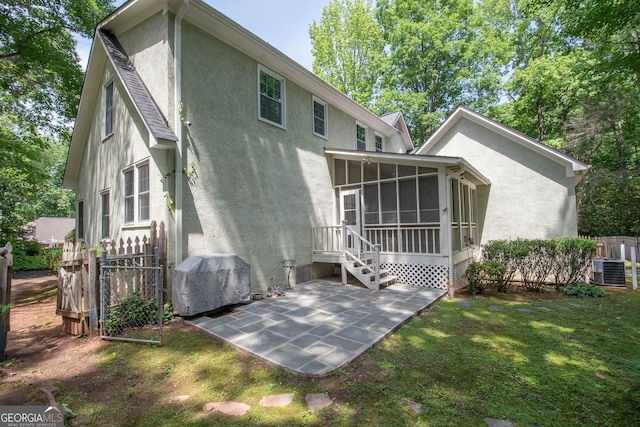 24 Overbrook Ct, Newnan, GA 30263 - back of property with a sunroom, stucco siding, a patio area, and central AC unit