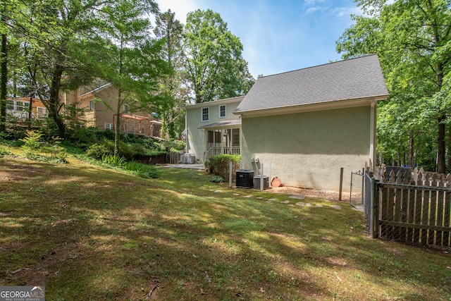 24 Overbrook Ct, Newnan, GA 30263 - back of property featuring stucco siding, central AC unit, and a shingled roof