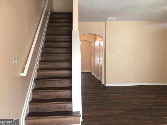 1938 Dilcrest Dr, Duluth, GA 30096 - stairs with arched walkways, wood finished floors, and baseboards