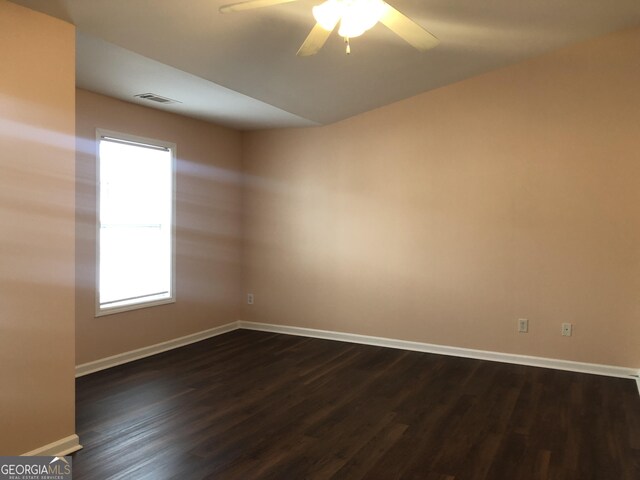 1938 Dilcrest Dr, Duluth, GA 30096 - unfurnished room featuring baseboards, dark wood-style floors, and a ceiling fan