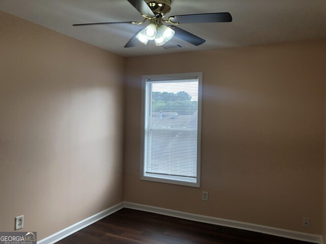 1938 Dilcrest Dr, Duluth, GA 30096 - empty room with dark wood-style floors, a ceiling fan, and baseboards