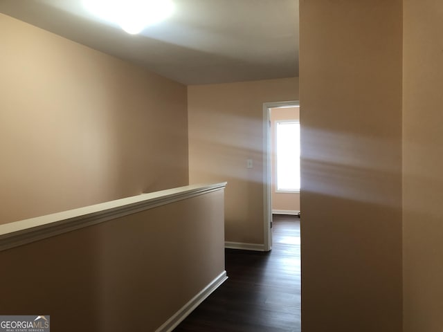 1938 Dilcrest Dr, Duluth, GA 30096 - hallway with baseboards, dark wood-style flooring, and an upstairs landing
