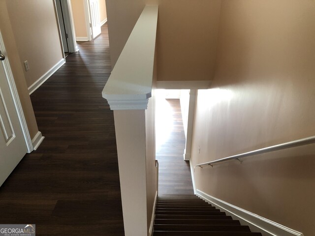 1938 Dilcrest Dr, Duluth, GA 30096 - stairs with wood finished floors and baseboards