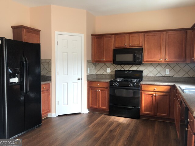 1938 Dilcrest Dr, Duluth, GA 30096 - kitchen with black appliances, dark wood-style floors, decorative backsplash, and brown cabinets