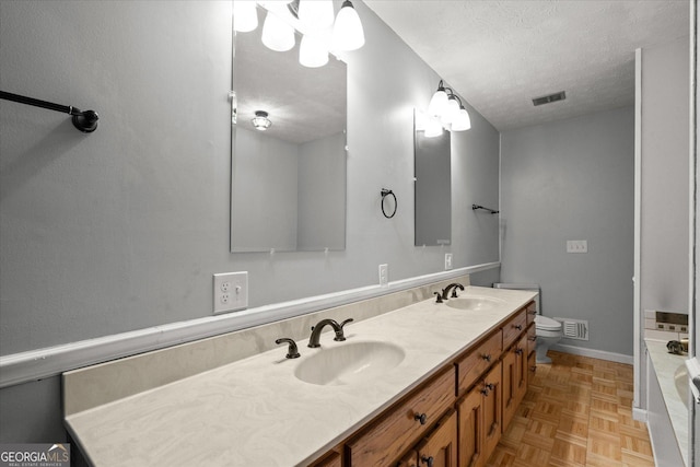 9020 Lakeview Pkwy, Villa Rica, GA 30180 - full bath featuring toilet, double vanity, a textured ceiling, and a tub to relax in