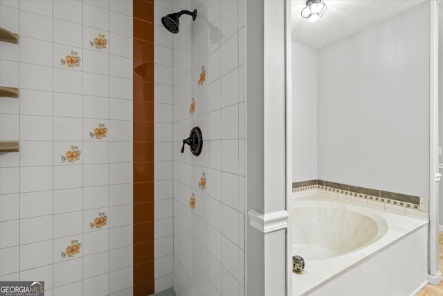 9020 Lakeview Pkwy, Villa Rica, GA 30180 - full bath featuring a tile shower, a bath, and a textured ceiling