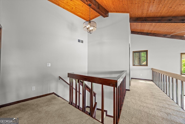 9020 Lakeview Pkwy, Villa Rica, GA 30180 - hall with carpet floors, wooden ceiling, an upstairs landing, baseboards, and a chandelier