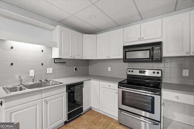 9020 Lakeview Pkwy, Villa Rica, GA 30180 - kitchen featuring black appliances, a sink, a drop ceiling, white cabinets, and backsplash