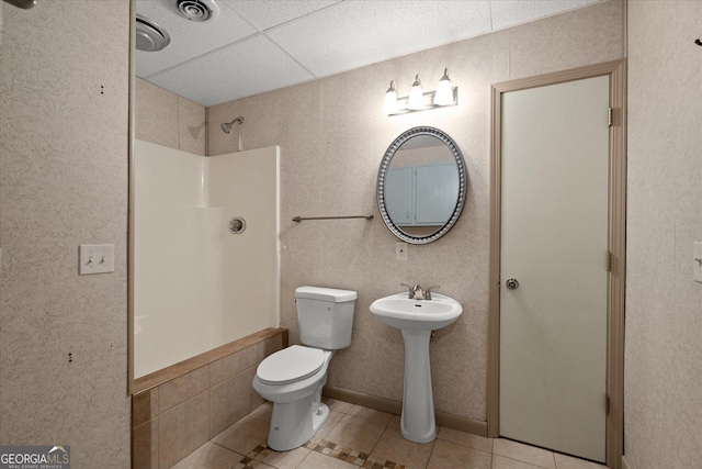 9020 Lakeview Pkwy, Villa Rica, GA 30180 - full bathroom with tile patterned flooring, a shower, toilet, and a sink