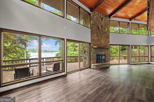 9020 Lakeview Pkwy, Villa Rica, GA 30180 - unfurnished living room featuring high vaulted ceiling, a water view, beam ceiling, wood finished floors, and wooden ceiling