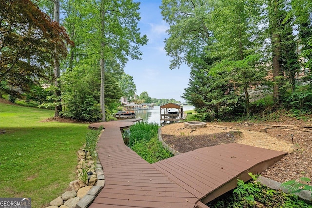 9020 Lakeview Pkwy, Villa Rica, GA 30180 - deck with a lawn, an outdoor fire pit, and a boat dock