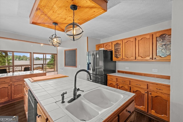 9020 Lakeview Pkwy, Villa Rica, GA 30180 - kitchen featuring tile countertops, a sink, stainless steel appliances, and brown cabinetry