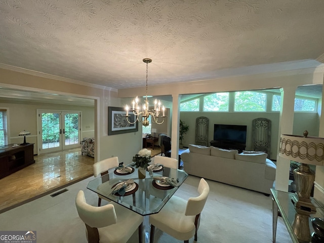 1260 Willeo Creek Dr, Roswell, GA 30075 - dining space with a chandelier, a textured ceiling, crown molding, and french doors