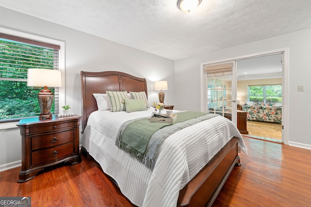 1260 Willeo Creek Dr, Roswell, GA 30075 - bedroom with wood finished floors and a textured ceiling