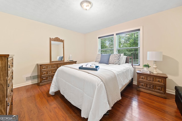 1260 Willeo Creek Dr, Roswell, GA 30075 - bedroom with wood finished floors and a textured ceiling