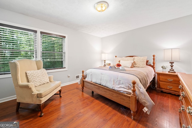 1260 Willeo Creek Dr, Roswell, GA 30075 - bedroom with baseboards and wood finished floors