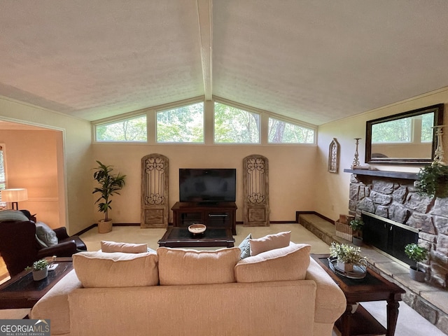 1260 Willeo Creek Dr, Roswell, GA 30075 - living area featuring vaulted ceiling, a stone fireplace, and plenty of natural light