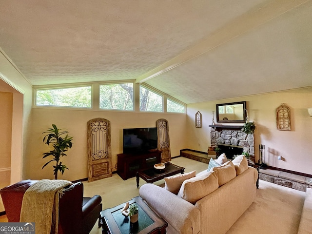 1260 Willeo Creek Dr, Roswell, GA 30075 - living area featuring light carpet, a stone fireplace, vaulted ceiling, and a textured ceiling