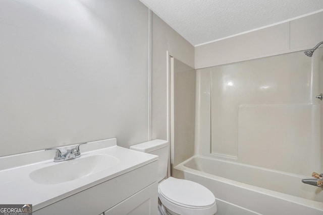 27 Pocahontas Rd, Midway, GA 31320 - bathroom with a textured ceiling, toilet, vanity, and washtub / shower combination