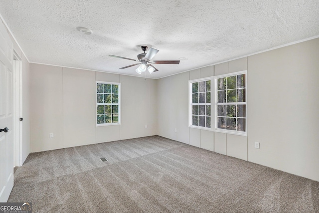 27 Pocahontas Rd, Midway, GA 31320 - unfurnished room featuring carpet flooring, ceiling fan, and a textured ceiling