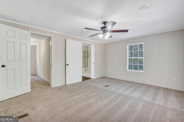 27 Pocahontas Rd, Midway, GA 31320 - unfurnished bedroom featuring carpet flooring, a textured ceiling, crown molding, and ceiling fan