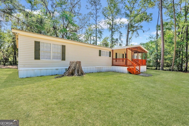 27 Pocahontas Rd, Midway, GA 31320 - back of house with a lawn