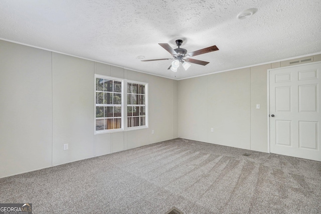 27 Pocahontas Rd, Midway, GA 31320 - carpeted spare room featuring crown molding, ceiling fan, and a textured ceiling