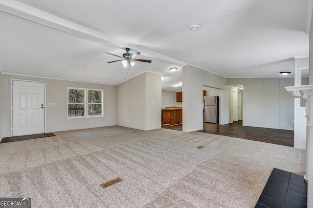 27 Pocahontas Rd, Midway, GA 31320 - unfurnished living room featuring carpet, a ceiling fan, ornamental molding, and a textured ceiling