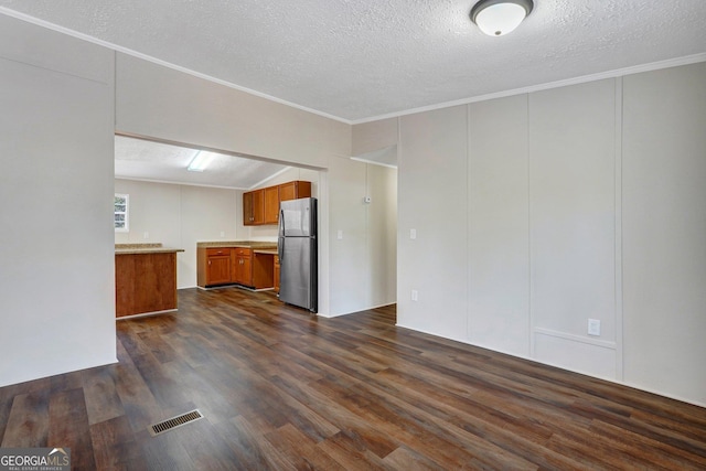 27 Pocahontas Rd, Midway, GA 31320 - unfurnished living room with dark wood-style floors, a textured ceiling, ornamental molding, and lofted ceiling