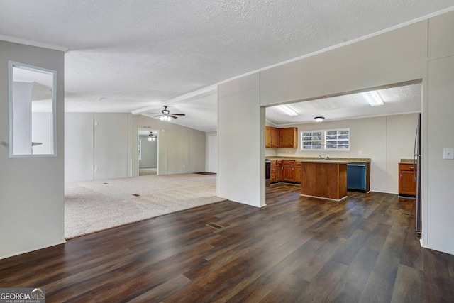 27 Pocahontas Rd, Midway, GA 31320 - unfurnished living room with dark wood-style floors, a textured ceiling, ornamental molding, vaulted ceiling, and ceiling fan