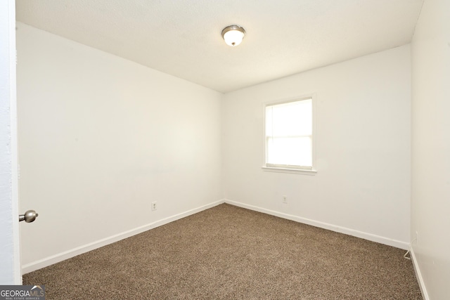 1309 Newton Rd, Albany, GA 31701 - unfurnished room featuring dark carpet and baseboards