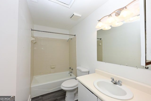 1309 Newton Rd, Albany, GA 31701 - full bath with wood finished floors, toilet, vanity, and shower / bathtub combination