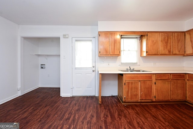 1309 Newton Rd, Albany, GA 31701 - kitchen featuring a sink, brown cabinets, dark wood-style flooring, and light countertops